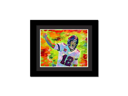 A painting of American football player Tom Brady yelling with his fist in the air, rallying his teammates. Arbitrary colors and visible brushstrokes add to the energy of this painting, alongside the bright greens, reds, and oranges of the backdrop. Printed on paper, matted, and framed.