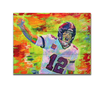 A painting of American football player Tom Brady yelling with his fist in the air, rallying his teammates. Arbitrary colors and visible brushstrokes add to the energy of this painting, alongside the bright greens, reds, and oranges of the backdrop. Printed on a box board.