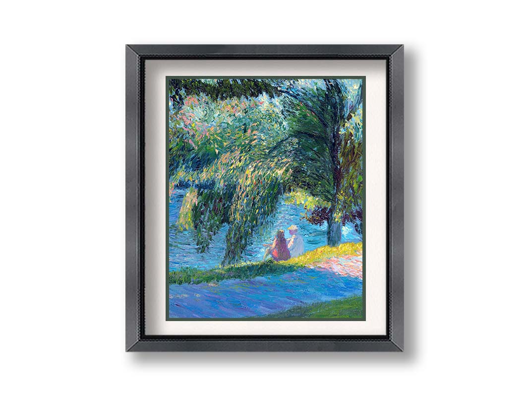 A painting of two people sitting by the water, near a park sidewalk, with a lare tree above them. Printed on paper, matted, and framed.