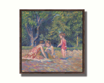 A painting of three children playing in the sand at a beach. Their red swimsuits contrast the green foliage in the background. Printed on canvas in a float frame.