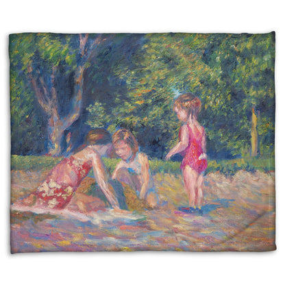 A fleece blanket designed with a painting of three children playing in the sand at a beach. Their red swimsuits contrast the green foliage in the background.