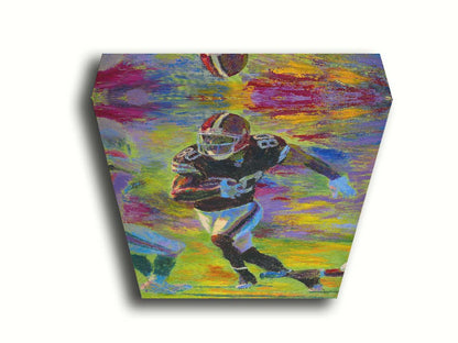 A painting of a football player running acoss the field with the ball, narrowly avoiding the opposing team's players. Printed on canvas.