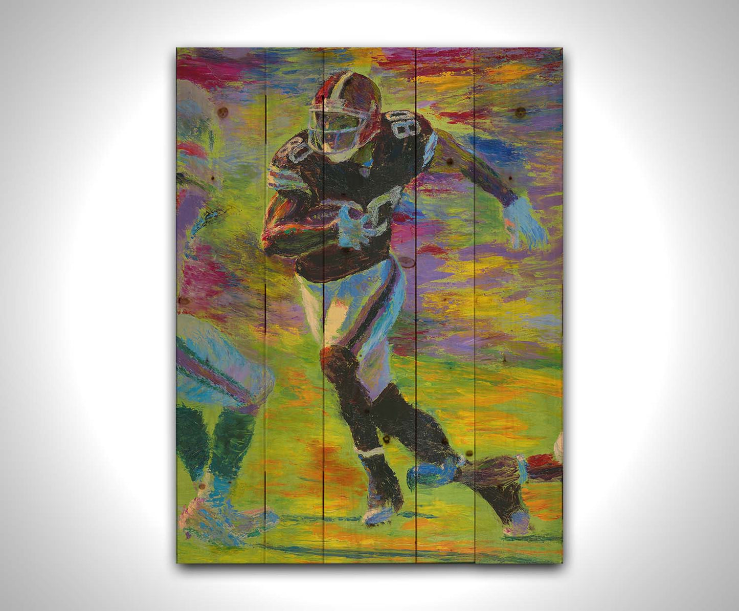 A painting of a football player running acoss the field with the ball, narrowly avoiding the opposing team's players. Printed on a wood pallet.