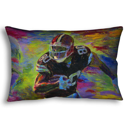 A throw pillow designed with a painting of a football player running across the field with the ball, narrowly avoiding the opposing team's players.