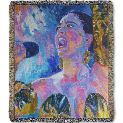 A woven throw blanket designed with a colorful impressionist portrait of pop musician Katy Perry wearing a gold dress and singing into a microphone.