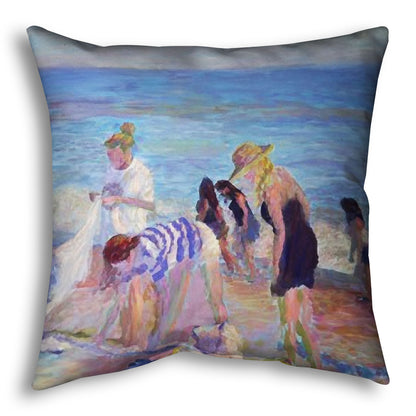 A throw pillow designed with a painting of beachgoers packing up their belongings after a relaxing day.