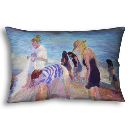 A throw pillow designed with a painting of beachgoers packing up their belongings after a relaxing day.
