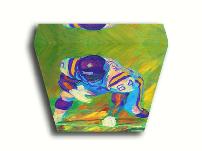 A painting of a football player, wearing white and purple, crouched on a bright green field. Printed on canvas.