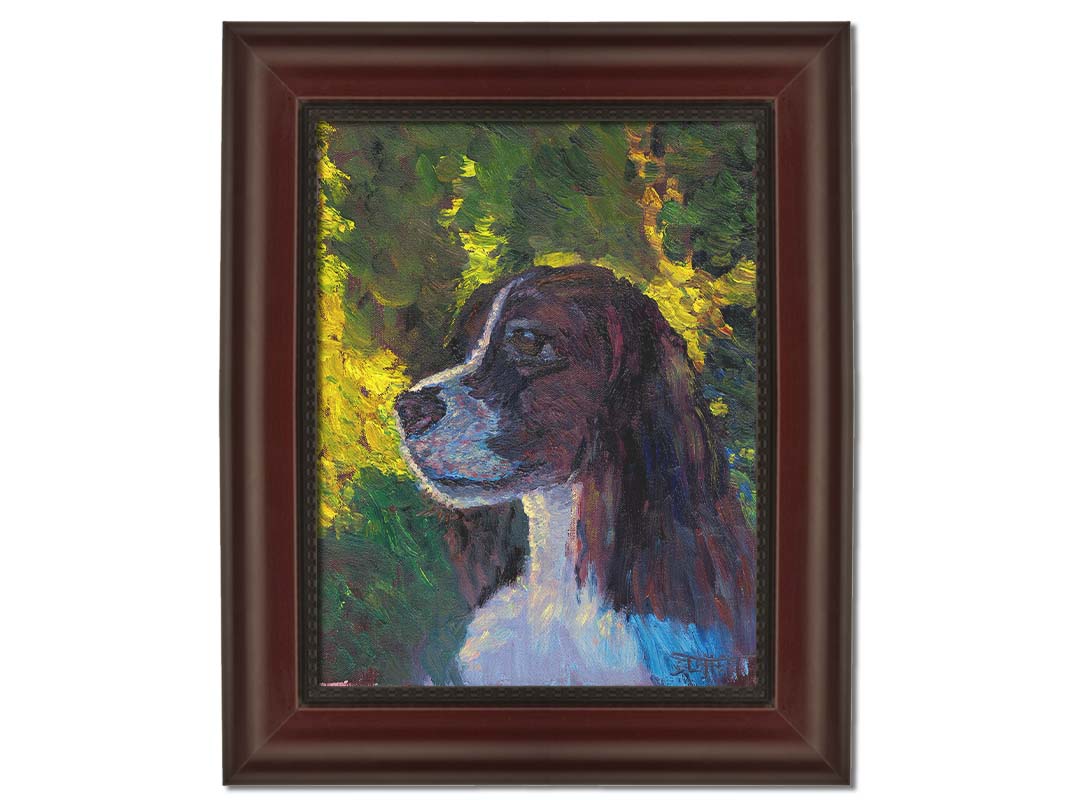 A painting of a brown and white spaniel dog, against a background of greens suggestinng foliage. Printed on canvas and framed.