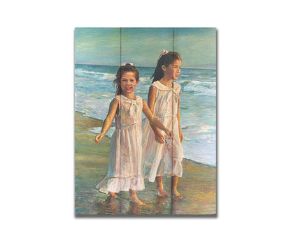 A painting of two children walking along the beach in matching white dresses. Printed on a box board.