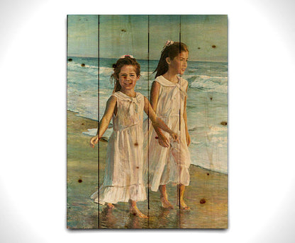 A painting of two children walking along the beach in matching white dresses. Printed on a wood pallet.