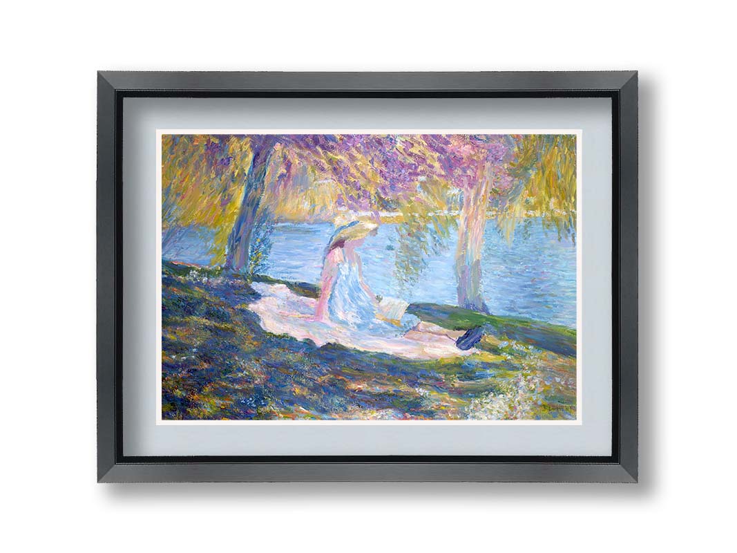 A painting of a person in a dress and sunhat, sitting on a blanket in the shade of trees by a lake, reading a book. Printed on paper, matted, and framed.