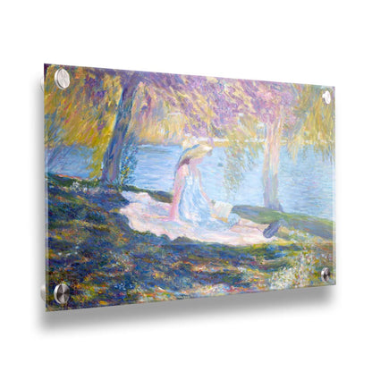 A painting of a person in a dress and sunhat, sitting on a blanket in the shade of trees by a lake, reading a book. Printed on acrylic.