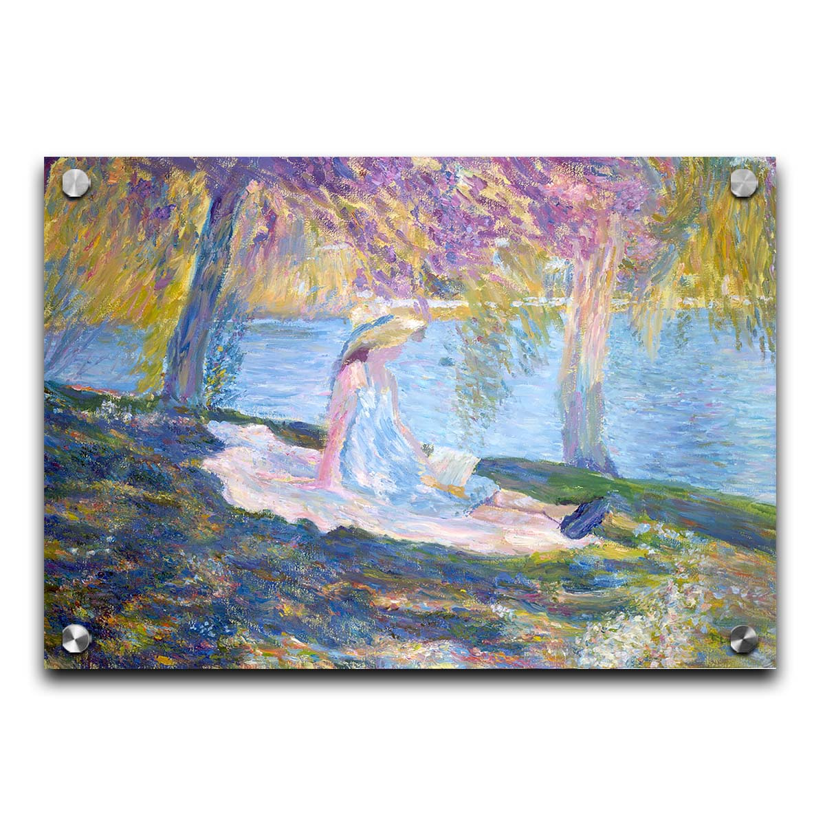 A painting of a person in a dress and sunhat, sitting on a blanket in the shade of trees by a lake, reading a book. Printed on acrylic.