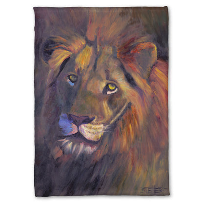 Fleece throw blanket designed with a portrait painting of a lion, accented with a soft gold light and purple shadows.