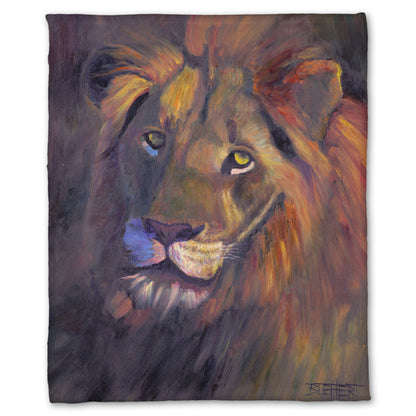Fleece throw blanket designed with a portrait painting of a lion, accented with a soft gold light and purple shadows.
