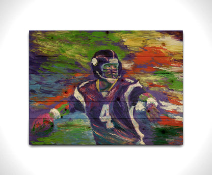 A painting of football player Brett Favre in his Minnesota Vikings uniform, poised to throw the football he is holding. Printed on a wood pallet.