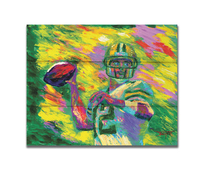 A painting of Green Bay Packers football player Aaron Rodgers, painted in the iconic yellow and green of the team and primed to throw a football. Printed on a box board.