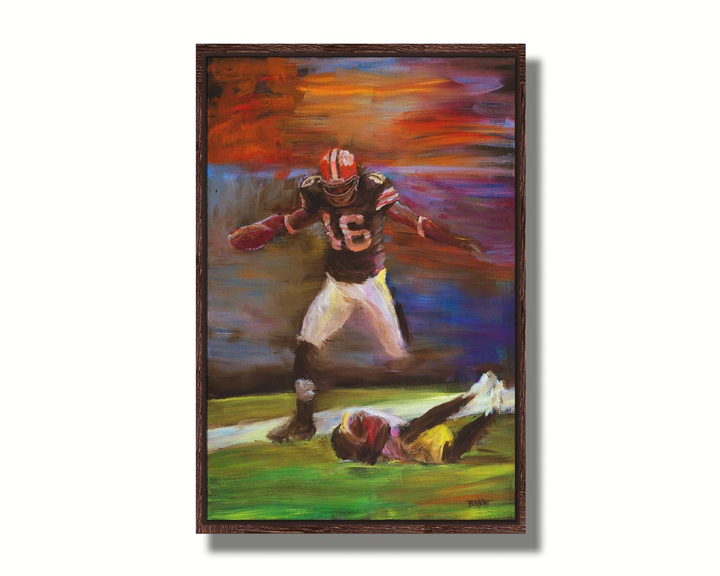 A painting of Cleveland Browns football player Josh Cribbs as he runs with the ball, dodging over another playerr. Printed on canvas in a float frame.