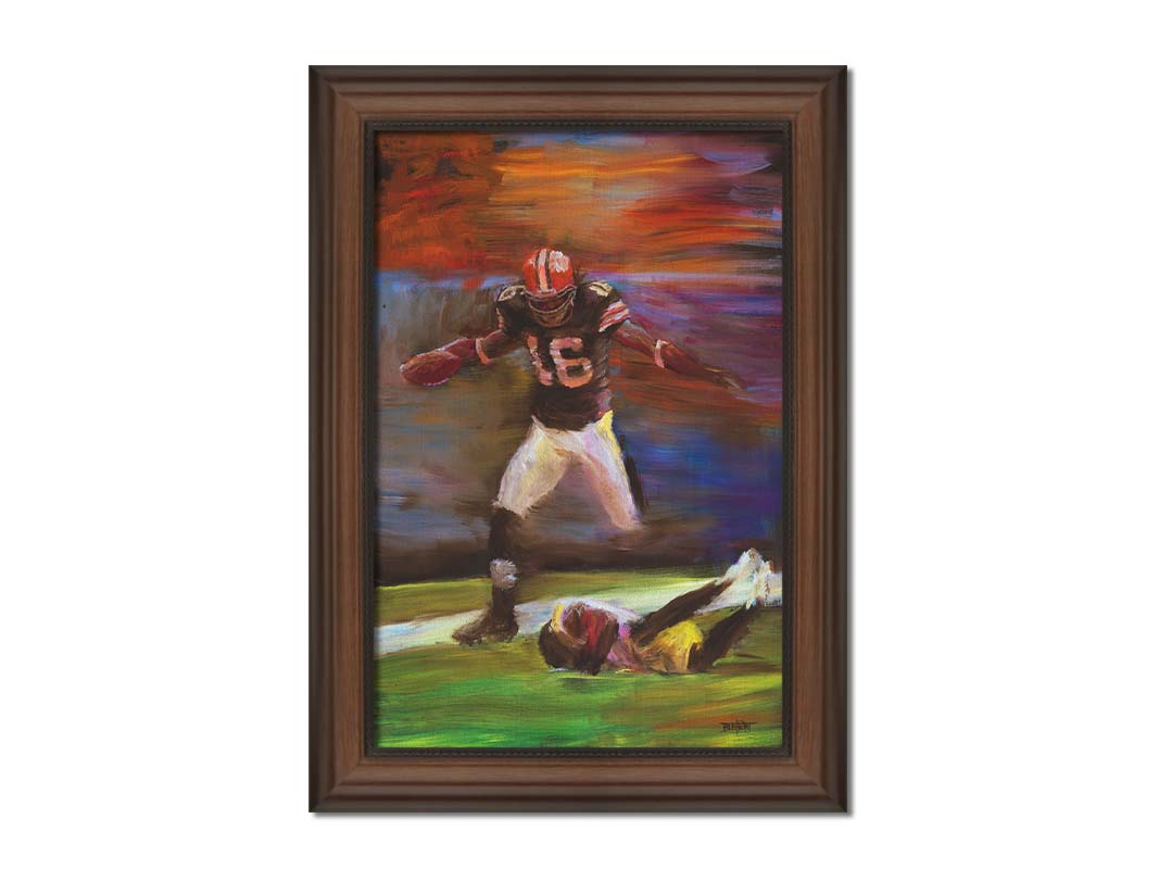 A painting of Cleveland Browns football player Josh Cribbs as he runs with the ball, dodging over another playerr. Printed on canvas and framed