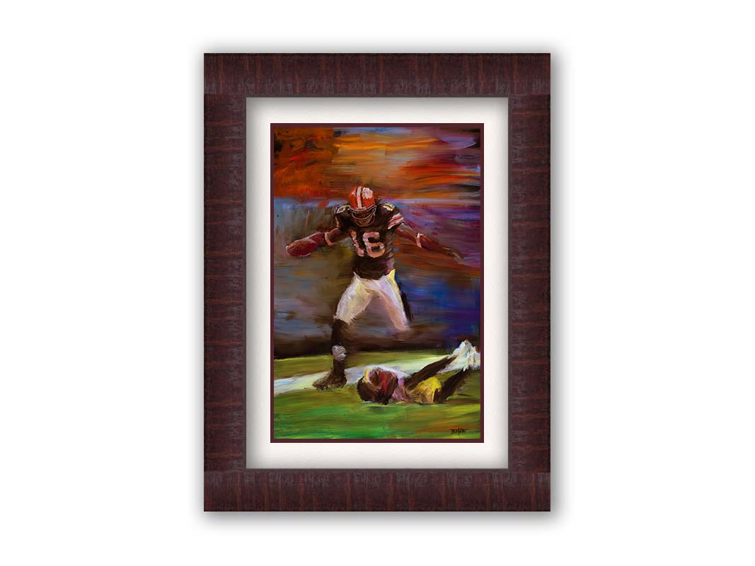 A painting of Cleveland Browns football player Josh Cribbs as he runs with the ball, dodging over another playerr. Printed on paper, matted, and framed.