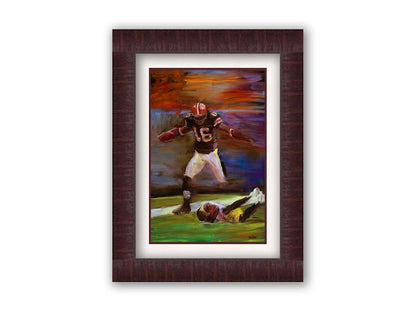 A painting of Cleveland Browns football player Josh Cribbs as he runs with the ball, dodging over another playerr. Printed on paper, matted, and framed.