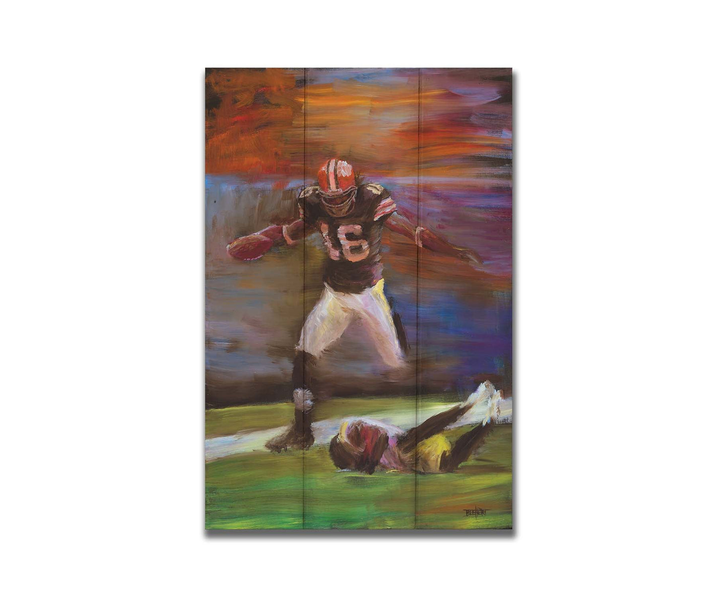 A painting of Cleveland Browns football player Josh Cribbs as he runs with the ball, dodging over another playerr. Printed on a box board.