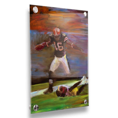 A painting of Cleveland Browns football player Josh Cribbs as he runs with the ball, dodging over another playerr. Printed on acrylic.