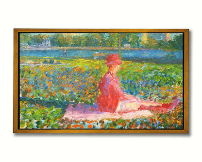 A painting of a lady dressed entirely in pink, sitting on a pink blanket in a city park. A pond can be seen in the background, with people walking along the paths and sitting on the benches. Printed on canvas in a float frame.