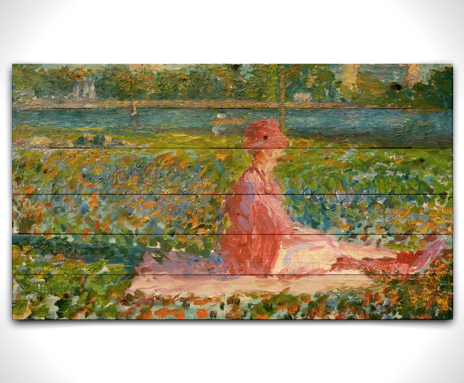 A painting of a lady dressed entirely in pink, sitting on a pink blanket in a city park. A pond can be seen in the background, with people walking along the paths and sitting on the benches. Printed on a wood pallet.