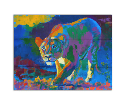 A painting of a lioness on the hunt. It is painted using arbitrary color, across a broad spectrum. Printed on a box board.