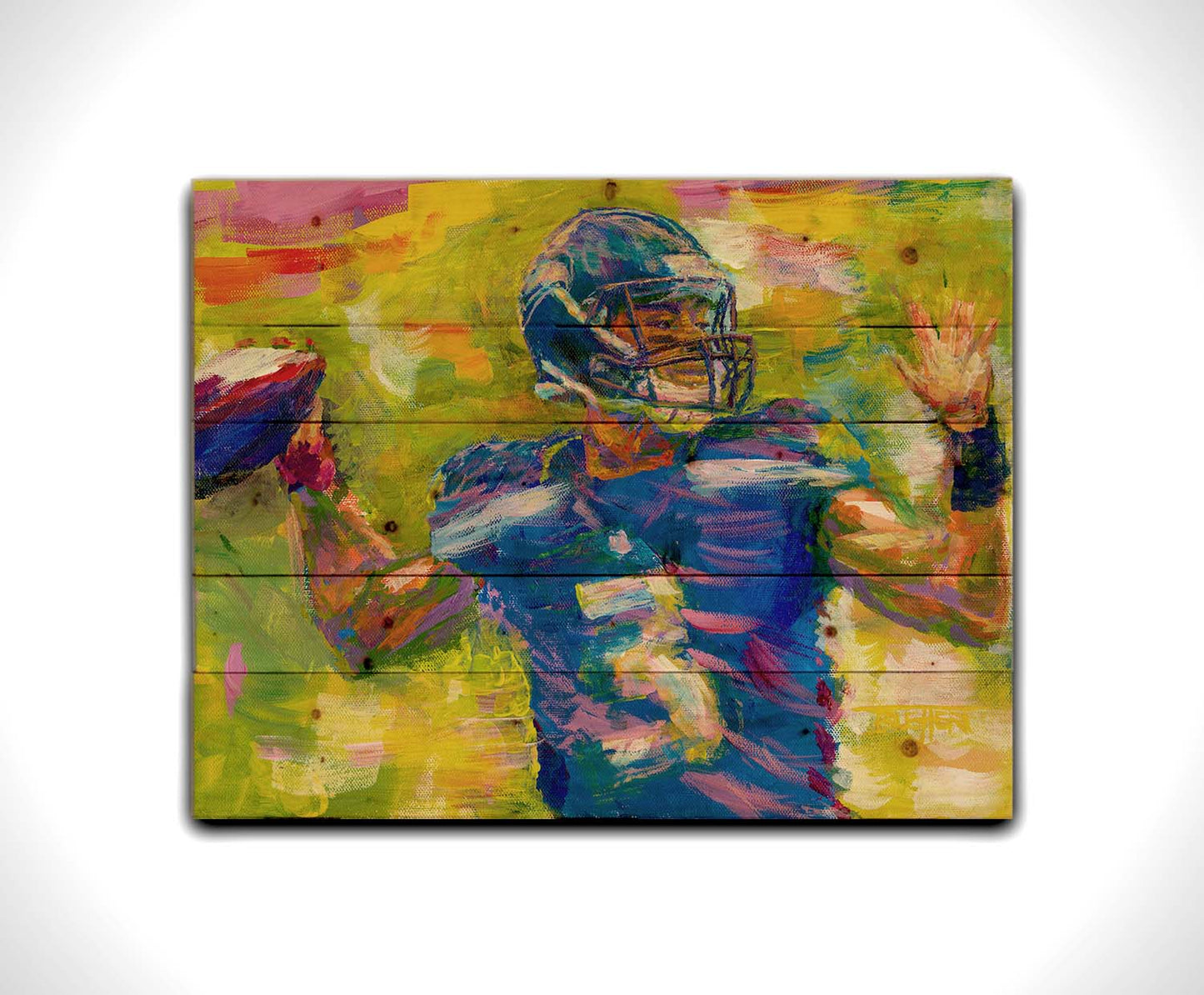 A painting of Seattle Seahawks football quarterback Russell Wilson throwing a football, contrasted against a bright, abstract green and yellow background. Printed on a wood pallet.