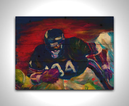 A painting of football player Walter Payton running across the field with the football, with the other team's players in pursuit. Printed on a wood pallet.