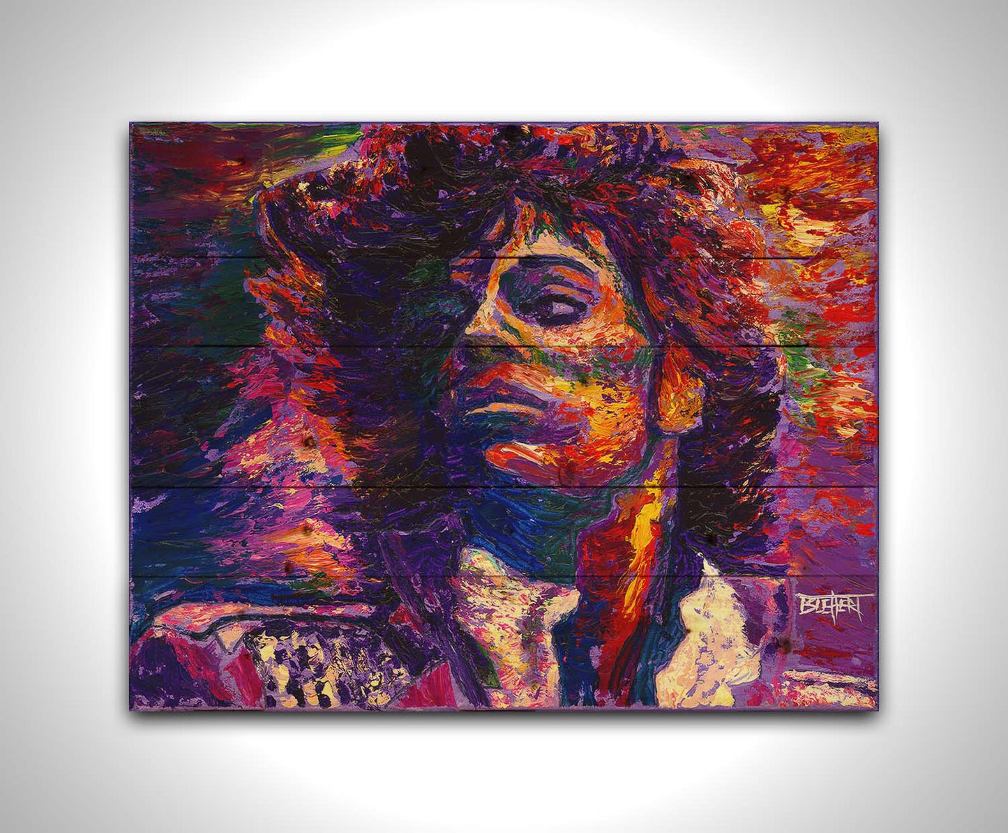 A painting of the musician Prince, painted in purple with blue shadows and red, white, and yellow highlights. Printed on a wood pallet.