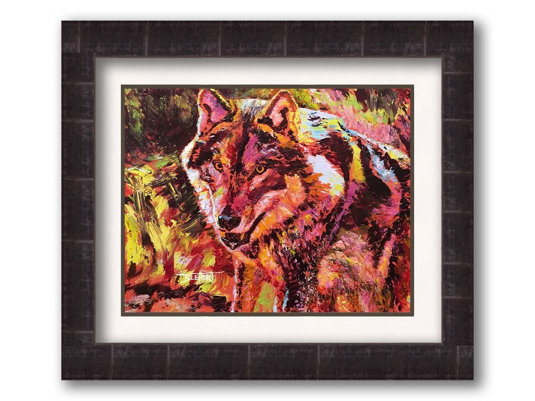 A painting of a wolf rendered in reds and yellows. Printed on paper, matted, and framed.