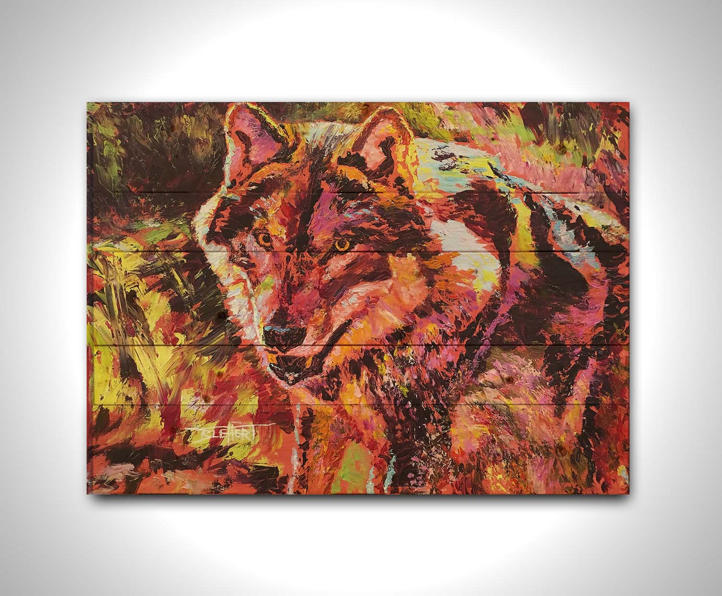 A painting of a wolf rendered in reds and yellows. Printed on a wood pallet.