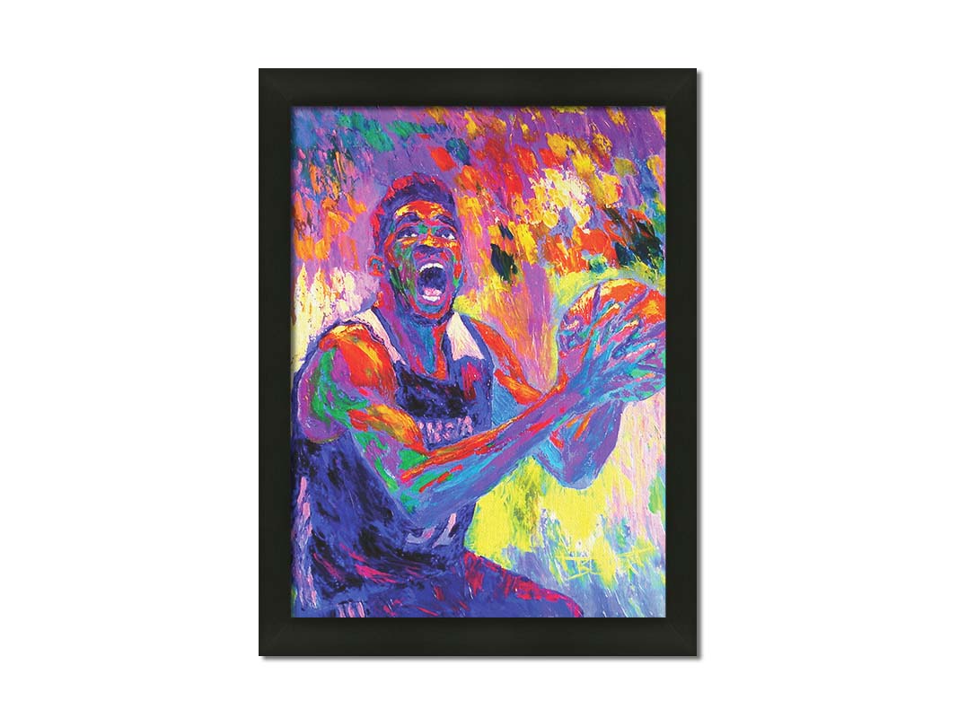 A paitning of Minnesota Timberwolves basketball player Karl Anthony Towns, holding the ball about to make a shot. Printed on canvas and framed.