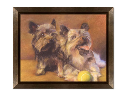 A painting of two brown terrier dogs sitting with a tennis ball. Printed on canvas and framed.