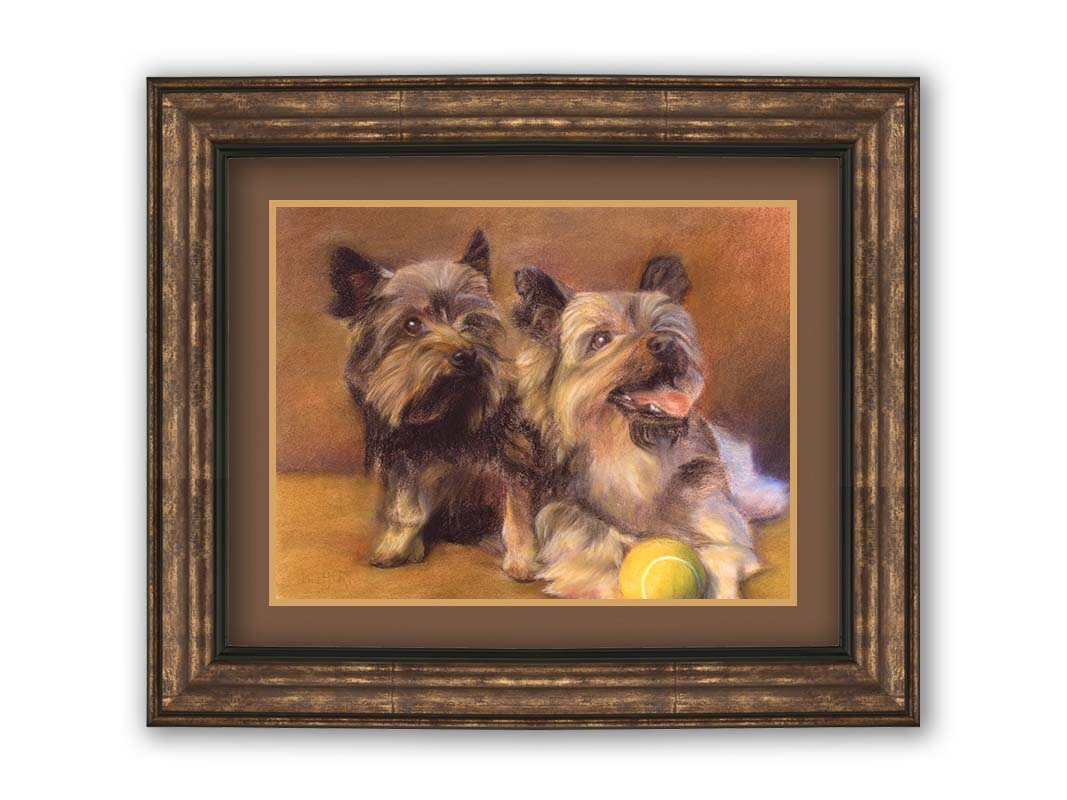 A painting of two brown terrier dogs sitting with a tennis ball. Printed on paper, matted, and framed.