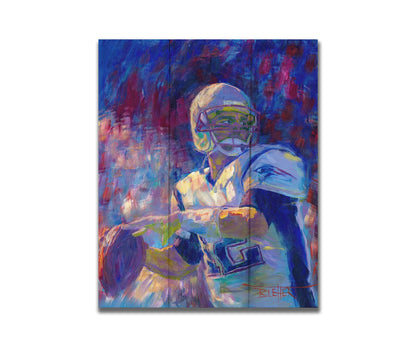 A painting of New England Patriots player Tom Brady preparing to throw a football. Printed on a box board.