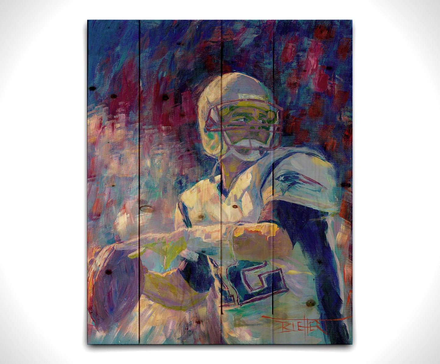 A painting of New England Patriots player Tom Brady preparing to throw a football. Printed on a wood pallet.