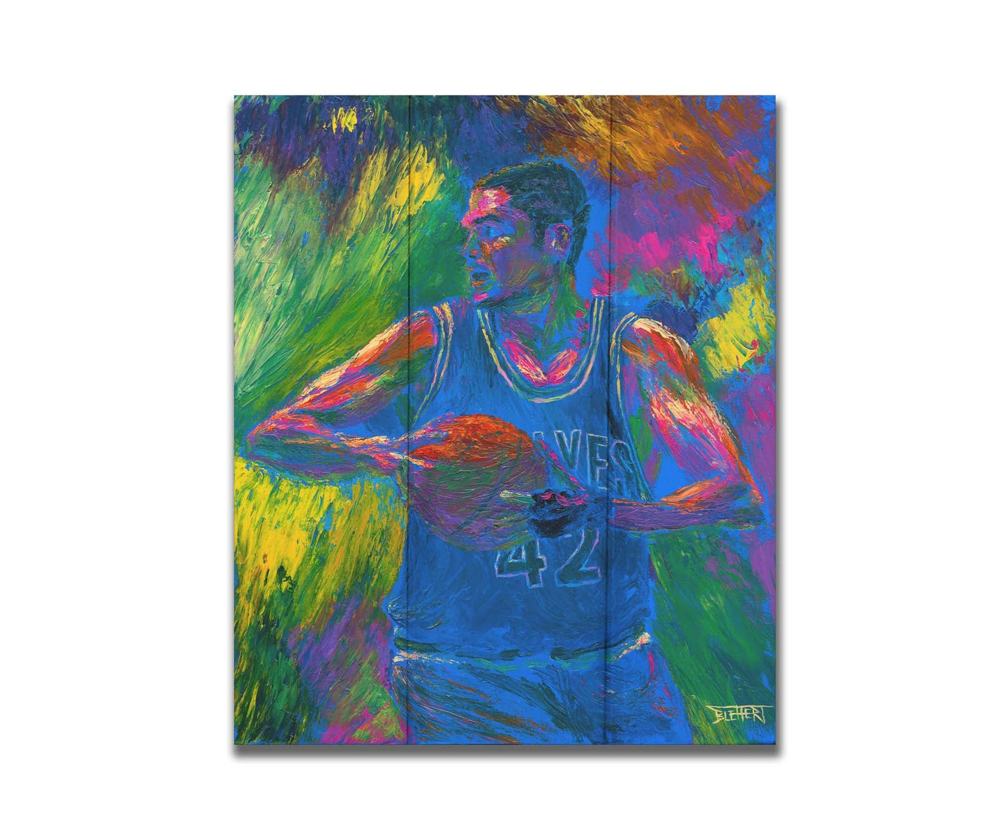 A painting of Minnesota TImberwolves basketball player Kevin Love holding a basketball. Printed on a box board.