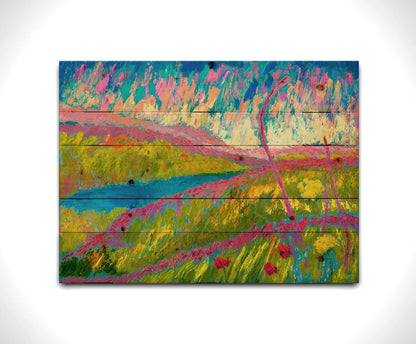 An abstracted painting of a green hilly landscape, with bright blue water and pink flowers. Printed on a wood pallet.