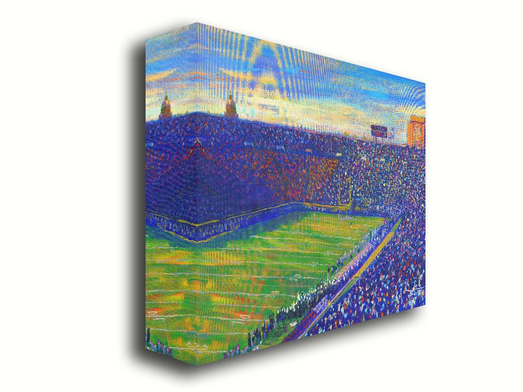 A painting of the Notre Dame Stadium in Notre Dame, Indiana. The stands are full as the crowd excitedly watches the football game. Printed on canvas.