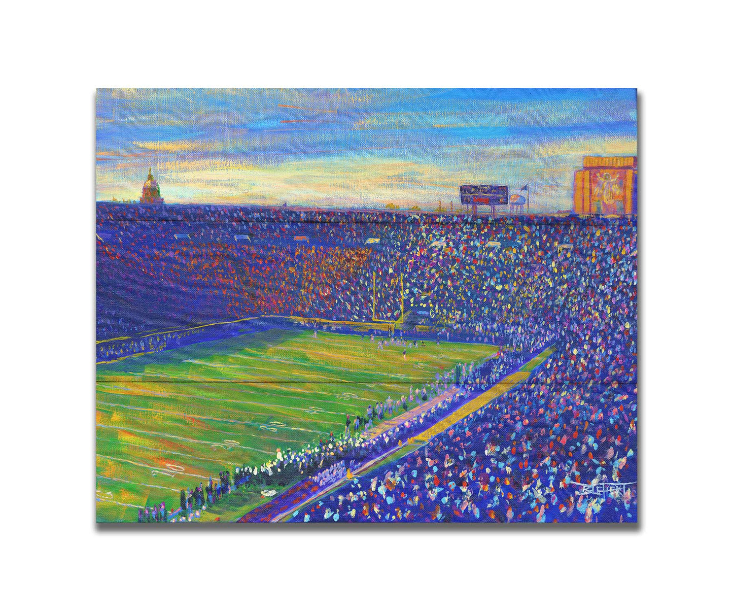 A painting of the Notre Dame Stadium in Notre Dame, Indiana. The stands are full as the crowd excitedly watches the football game. Printed on a box board.