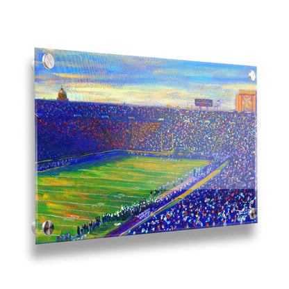 A painting of the Notre Dame Stadium in Notre Dame, Indiana. The stands are full as the crowd excitedly watches the football game. Printed on acrylic.