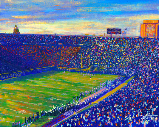 A painting of the Notre Dame Stadium in Notre Dame, Indiana. The stands are full as the crowd excitedly watches the football game.