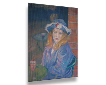 A portrait of a person in a blue outfit, sitting at a table outside a brick building with a drink. Printed on metal.