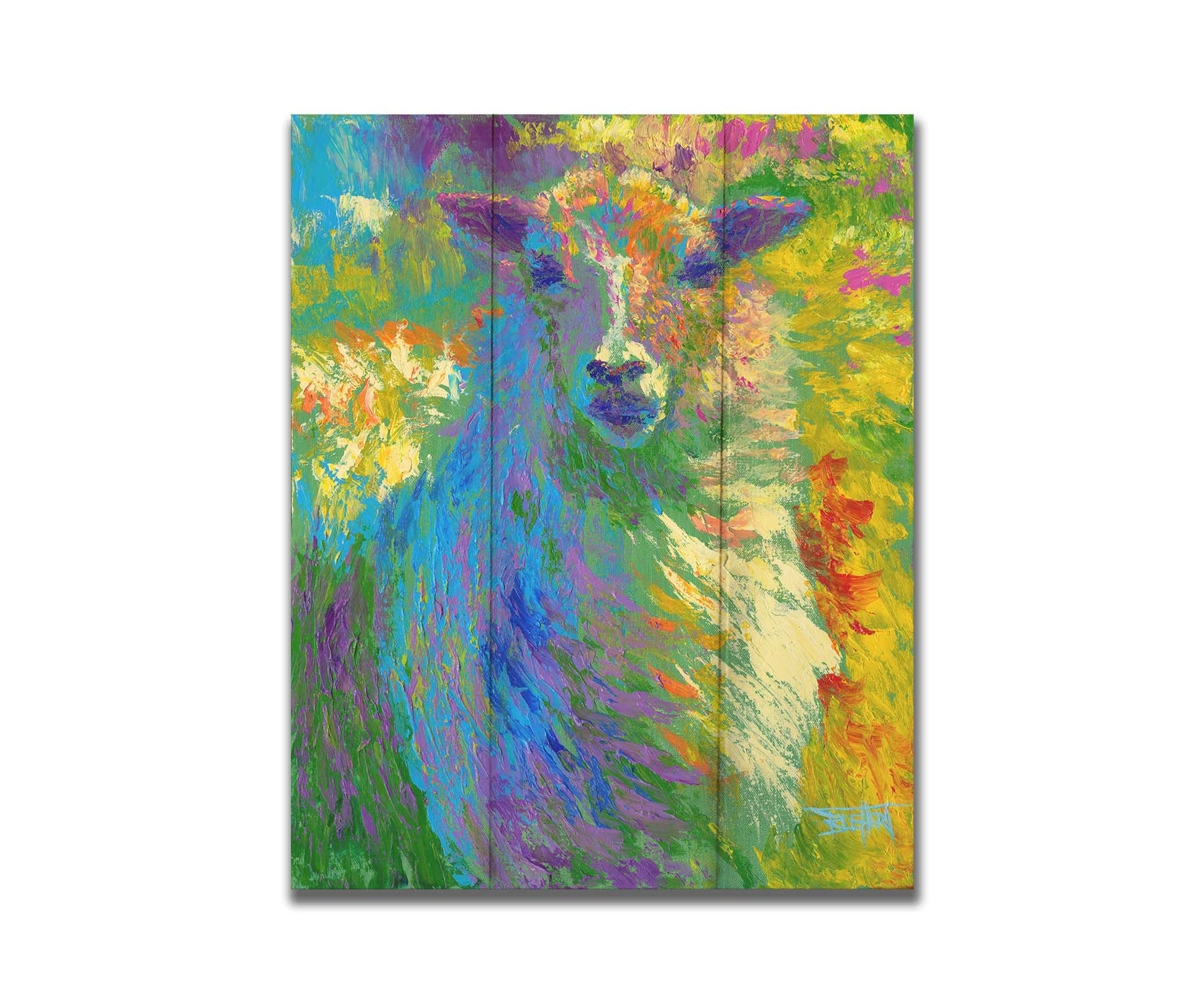 A colorful, bold painting of a sheep. The arrangement of color and visible brushstrokes emphasize the form and flow of the sheep's wool. Printed on a box board.