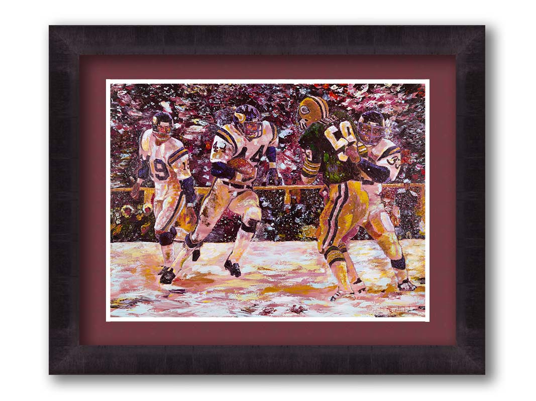 A painting of a snowy scene during the November 1977 football team between the Minnesota Vikings and the Green Bay Packers, centering on Vikings player Chuck Foreman as he runs the ball past an opponent with the help of his teammates. Printed on paper, matted, and framed.